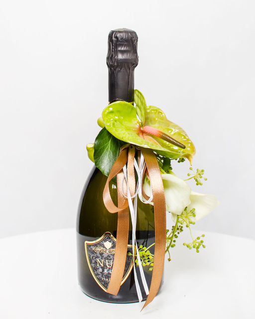 Sparkling wine with flower arrangement